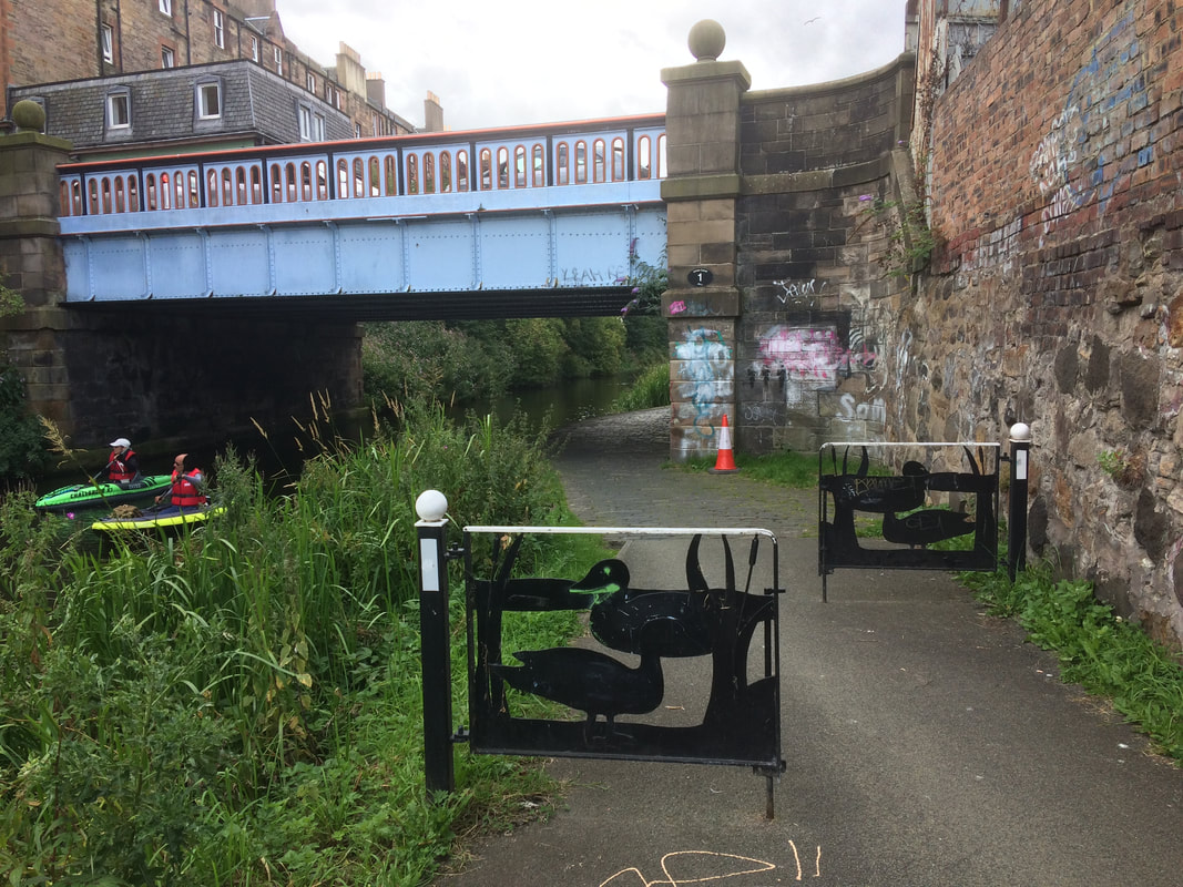 Barriers with duck pictures on the Union Canal path