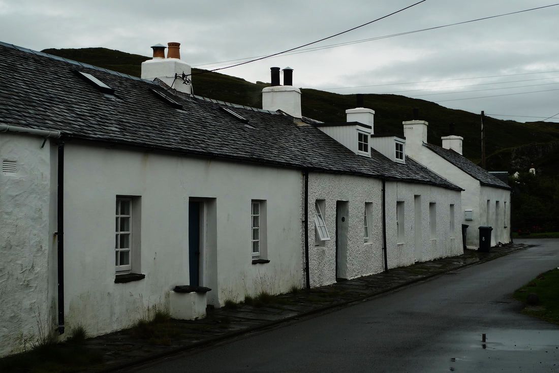 A row of white cottages in Cullipool on the Isle of Luing