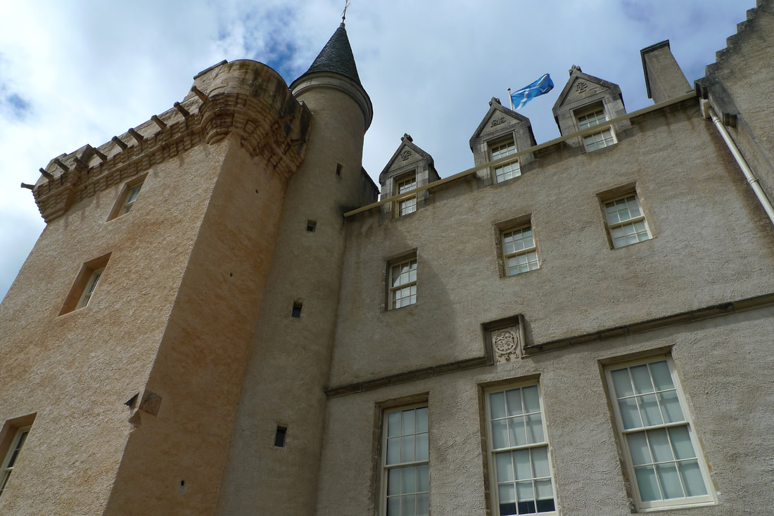 Brodie Castle with the flag of Scotland flying