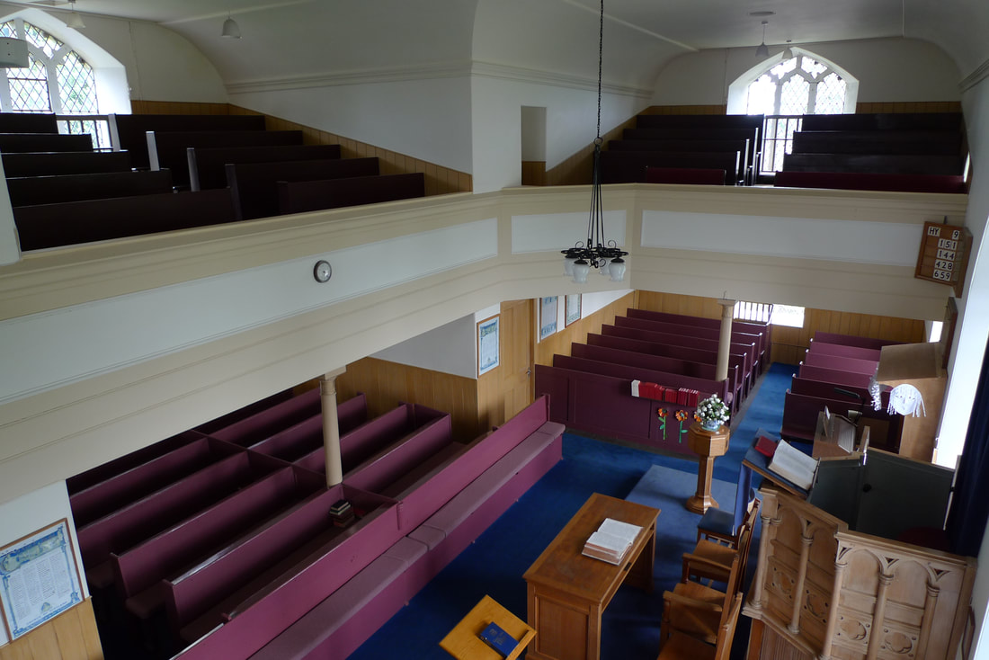 Inside Aberlemno Parish Church. There's a pulpit and an upper gallery