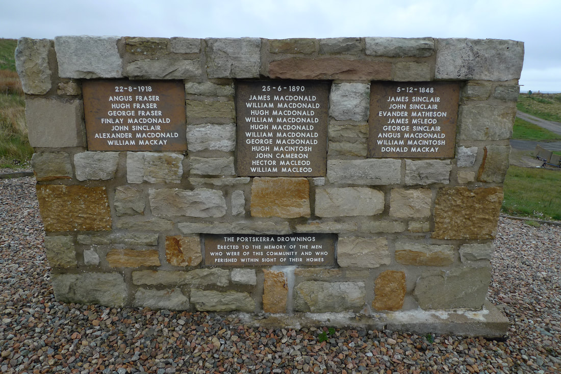 Portskerra memorial to fishermen who lost their lives at sea. It's made of stone with the names of the men in white writing.