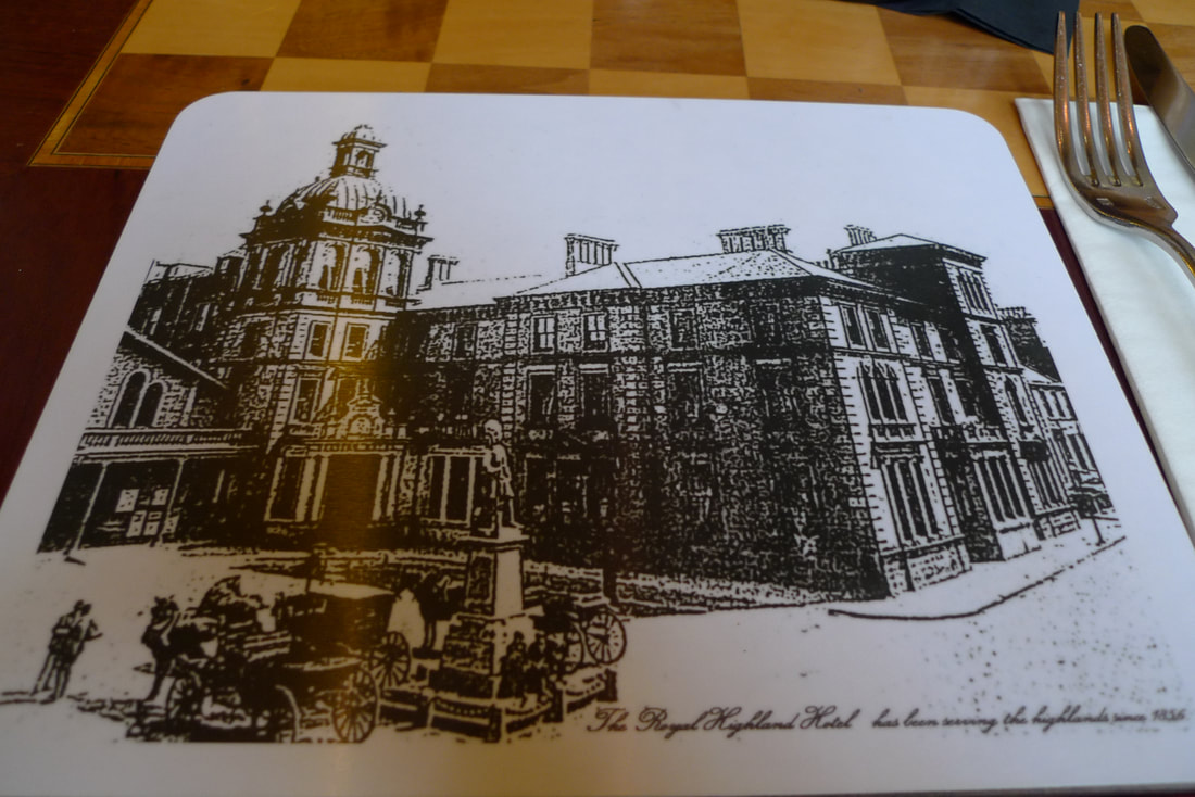 Place mat showing the Station Hotel, Inverness in 1856. There are horses and carriages parked at the front.