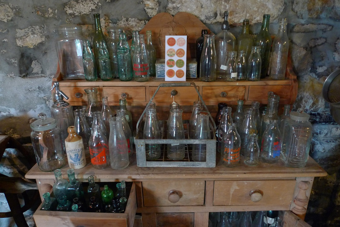 Antique glass jars at Dalgarven Mill
