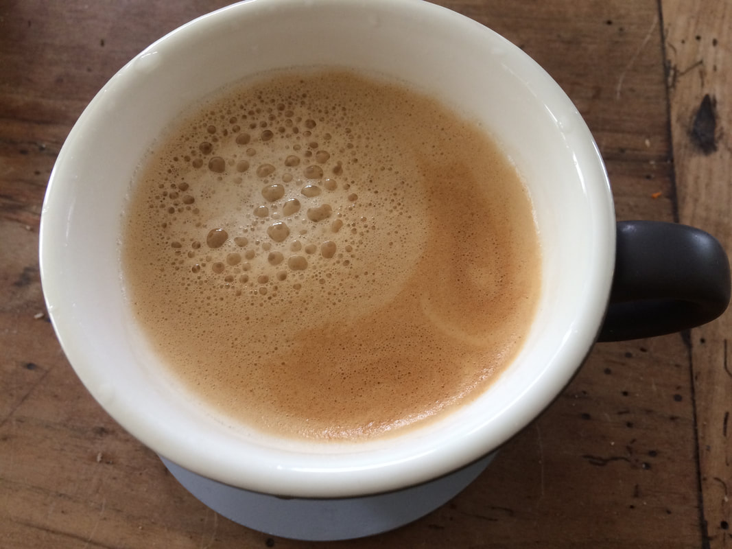 A cup of Rave Coffee's Colombian El Carmen pod