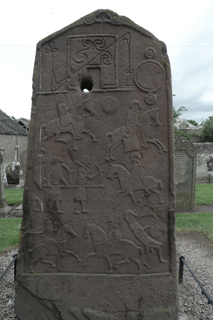 Battle scene on one of the Aberlemno stones. It has figures with helmets on horseback. Some have weapons and shields