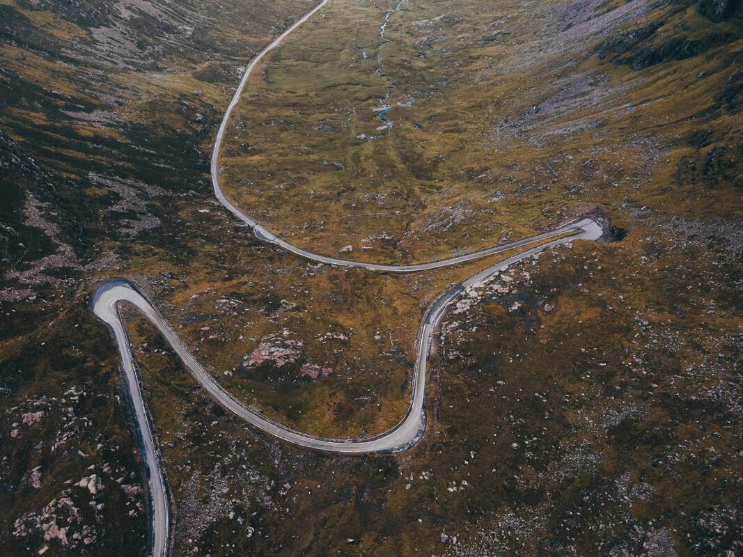 The Bealach na Ba road in Scotland, a steep climb with multiple hairpin bends. From a birds eye view.
