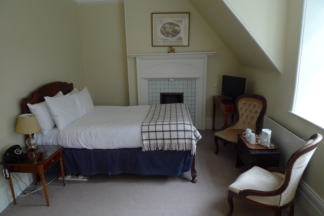 A bedroom in Knockomie Inn