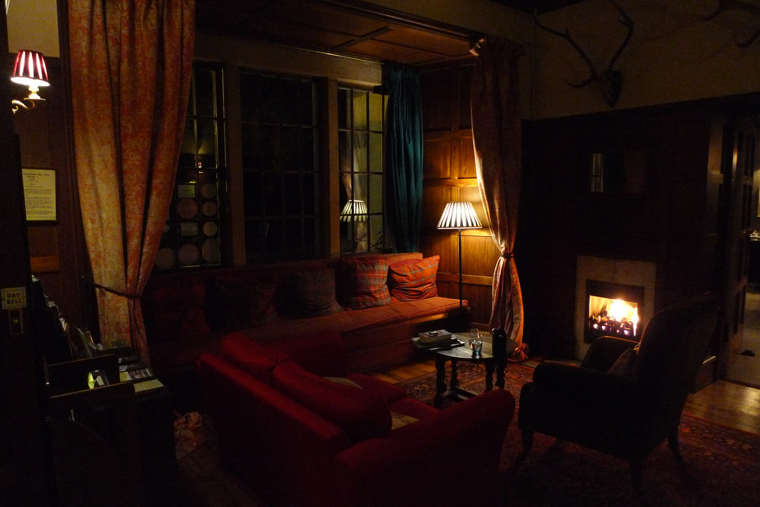 Lounge at Knockomie's Inn, with fire place in the evening