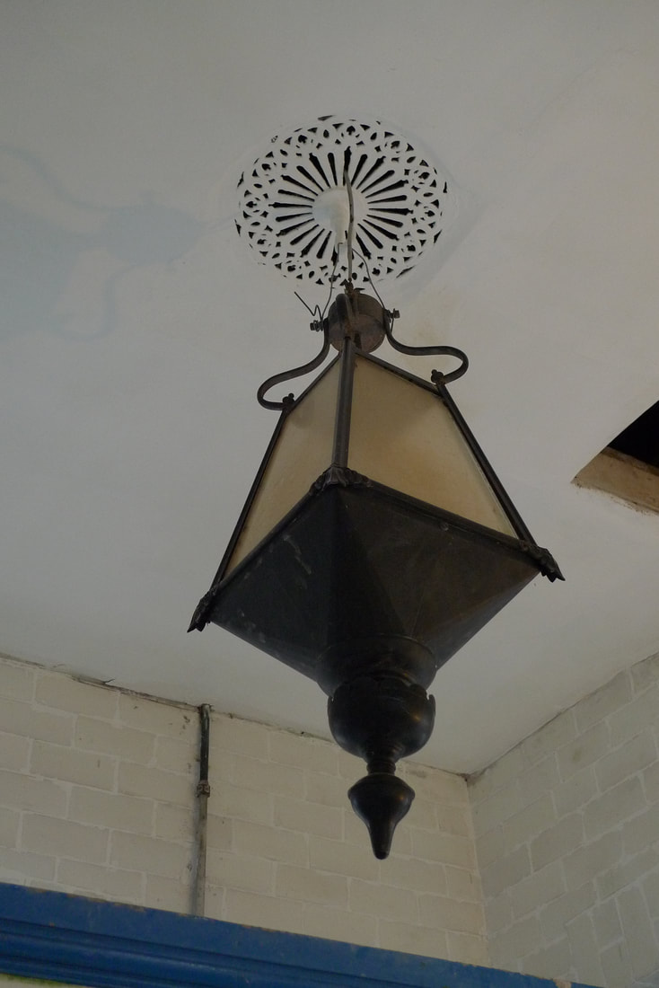 A decorative ceiling mount and lamp in Dalmally Station