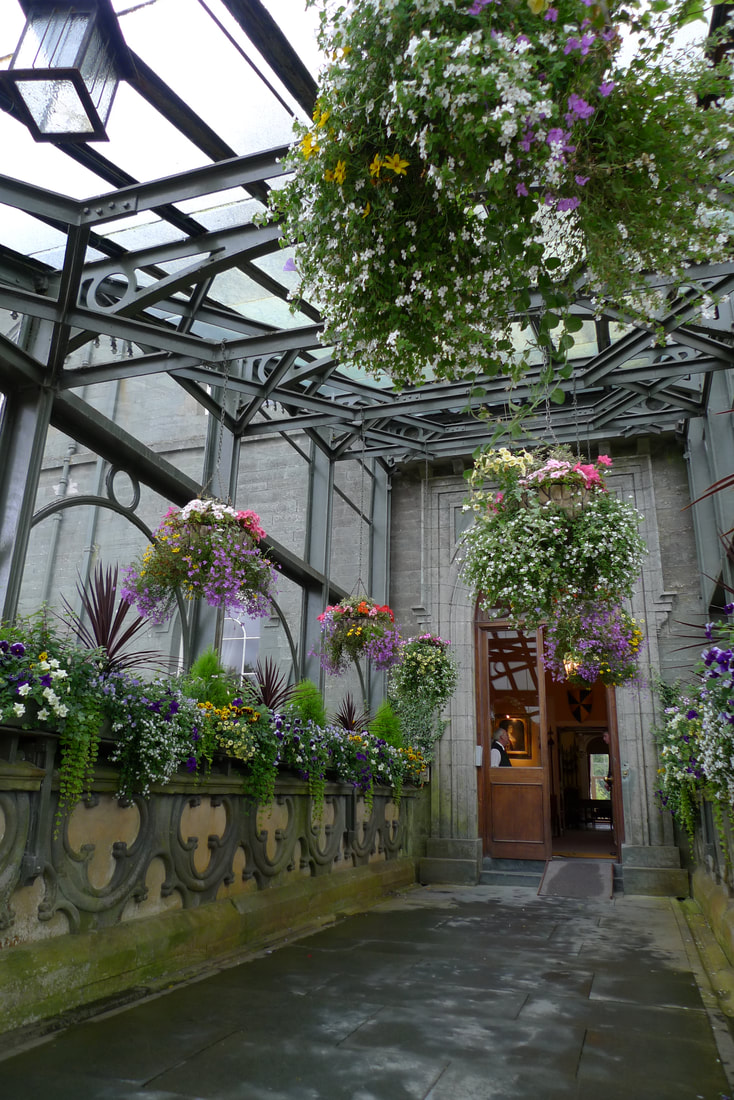 Entrance canopy to Inveraray Castle with plants and flowers